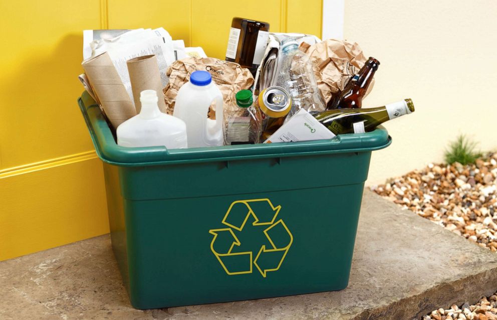 PHOTO: A curbside recycling bin full of mixed materials.