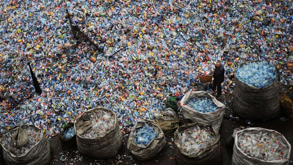 Many of China's recycling mills and farms are being forced to stop collecting recyclable scrap materials due to the nose-diving order prices as those of oil, metal and other commodities have plunged worldwide amid a worsening economic outlook.
Here a worker sorts used plastic bottles at a plastics recycling mill which is ceasing production, Oct. 29, 2008 in Wuhan, China.