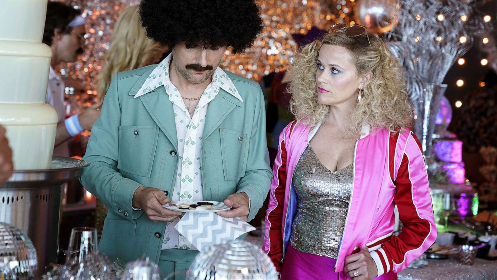 PHOTO: Reese Witherspoon in costume with Adam Scott in an episode of "Big Little Lies."