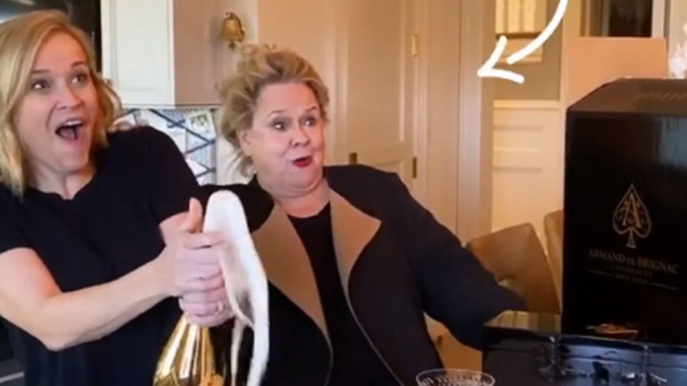 PHOTO: Reese Witherspoon opens a bottle of champagne with her mother in a video posted to her Instagram stories on Jan. 9, 2020.