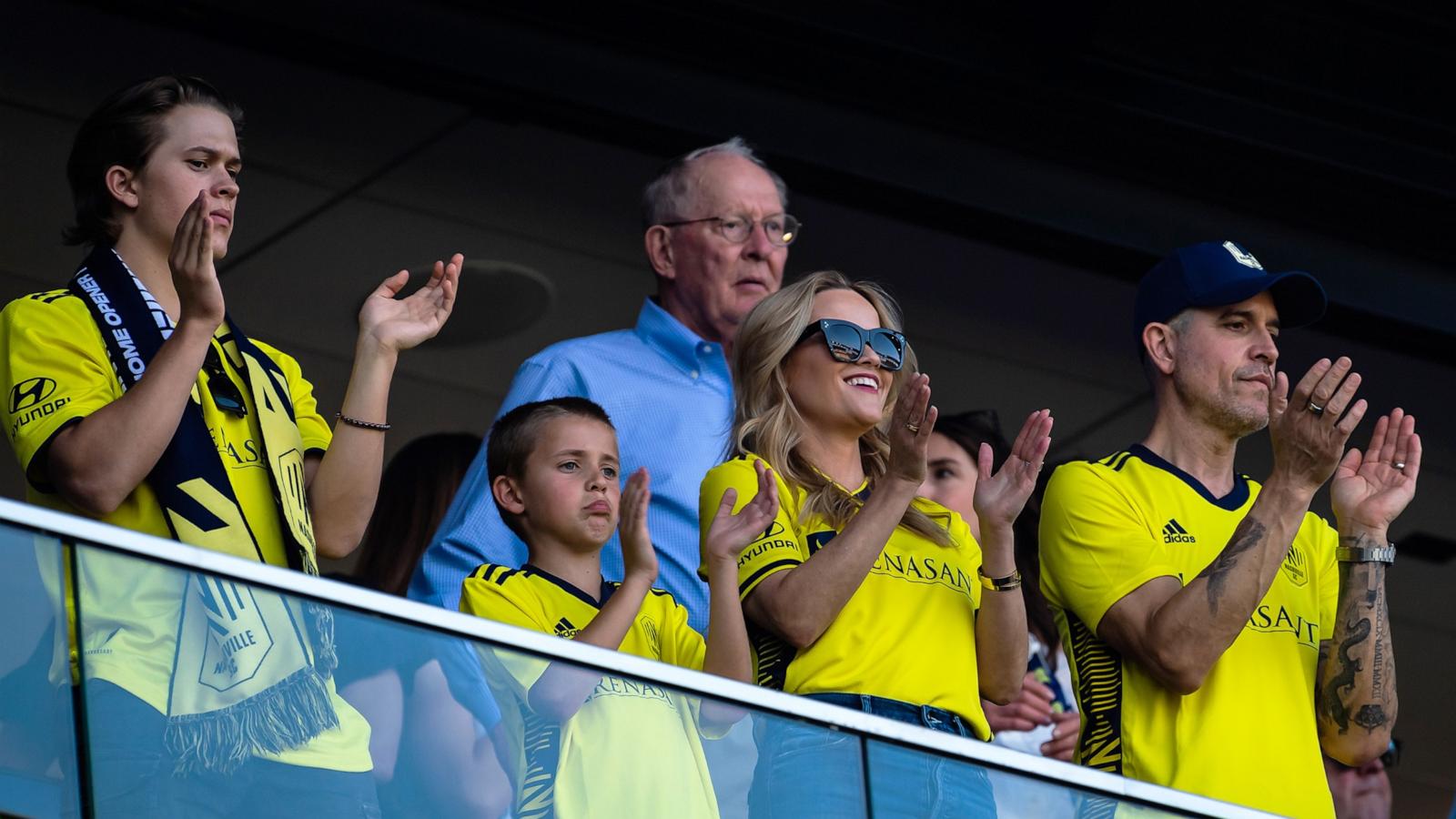 PHOTO: In this May 1, 2022, file photo, Reese Witherspoon, with her sons Deacon Phillippe, Tennessee Toth and her husband Jim Toth, cheers on the Nashville Soccer Club at GEODIS Park in Nashville, Tenn.