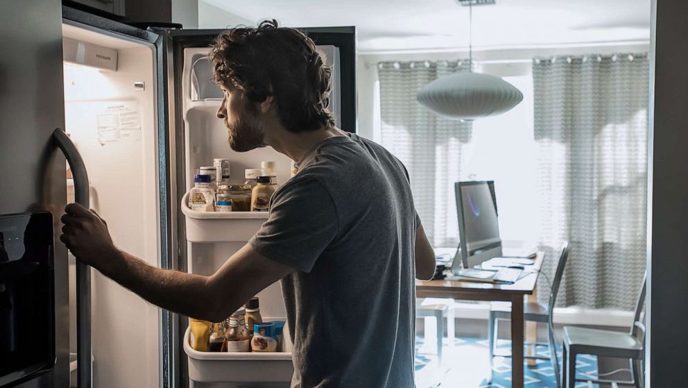 PHOTO: A man looks into a refrigerator in an undated stock photo.