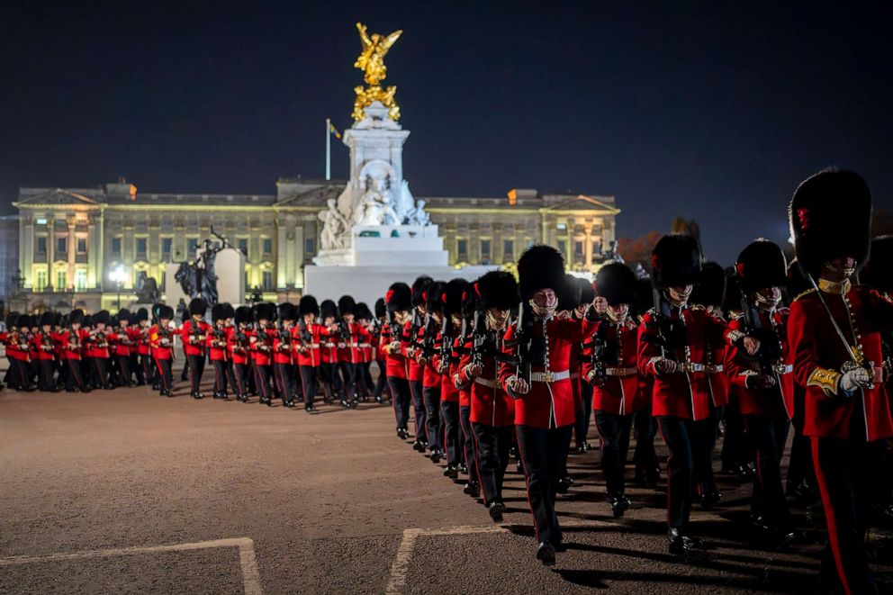 PHOTO: Members of the military march near Buckingham Palace in central London, May 2, 2023 during a rehearsal for the coronation of King Charles III which will take place at Westminster Abbey on May 6.