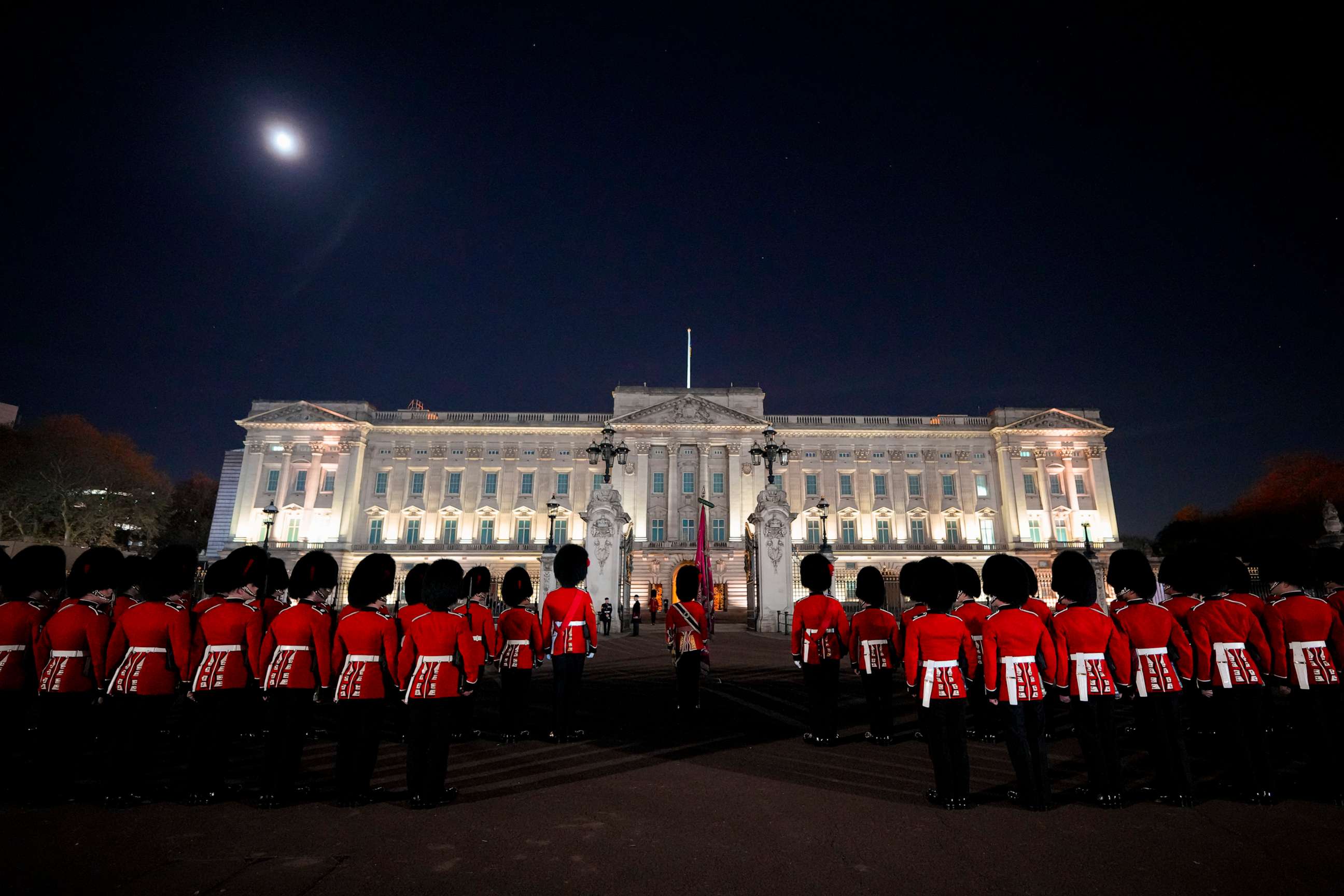 PHOTO: Members of the military stand in front of Buckingham Palace in central London, early Wednesday, May 3, 2023, during a rehearsal for the coronation of King Charles III which will take place at Westminster Abbey on May 6.
