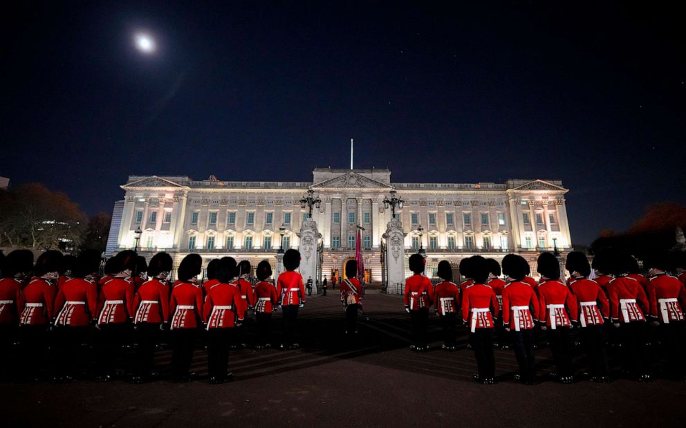 PHOTO: Members of the military stand in front of Buckingham Palace in central London, early Wednesday, May 3, 2023, during a rehearsal for the coronation of King Charles III which will take place at Westminster Abbey on May 6.