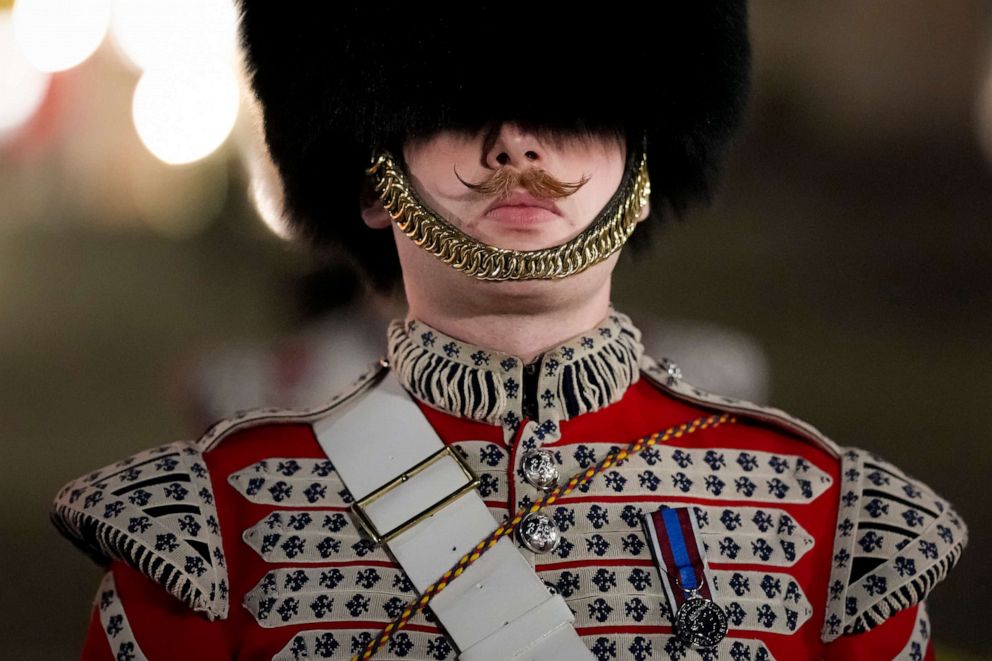 PHOTO: A member of the military marches on The Mall, in central London, early Wednesday, May 3, 2023, during a full-dress rehearsal for the Coronation of King Charles III.