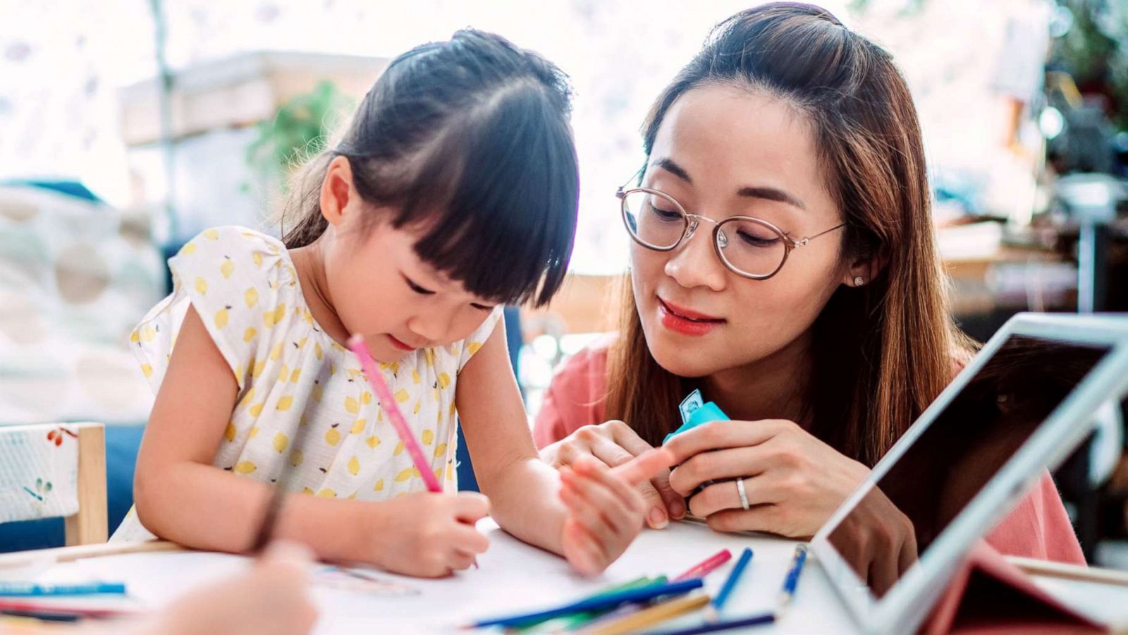 PHOTO: A woman homeschools her children in this stock photo.