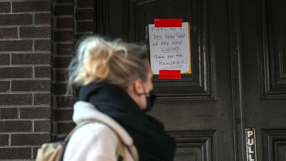 PHOTO: In this April 1, 2022, file photo, Forlini's, a 79-year-old restaurant located in the Little Italy neighborhood of New York, has a sign on their door announcing they are officially closed.