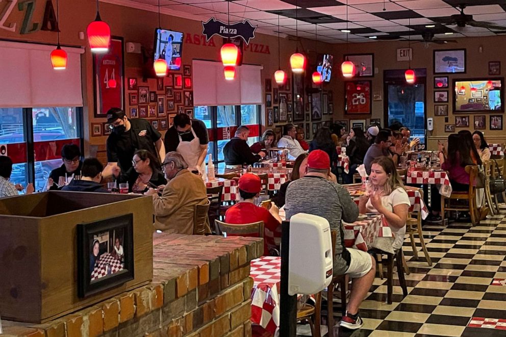 PHOTO: People dine at the Julian's Italian Pizzeria restaurant, on April 3, 2021, in San Antonio, Texas. 