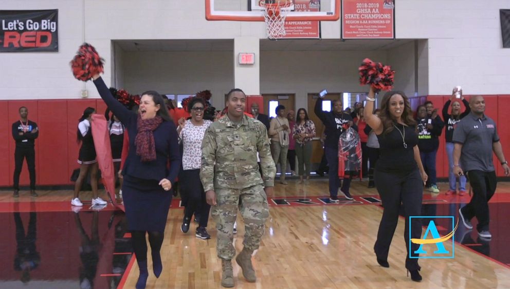 PHOTO: U.S. Army Spc. Shakir Aquil surprised his mom Atlanta Public Schools officer L.J. Williamson at a high school pep rally.