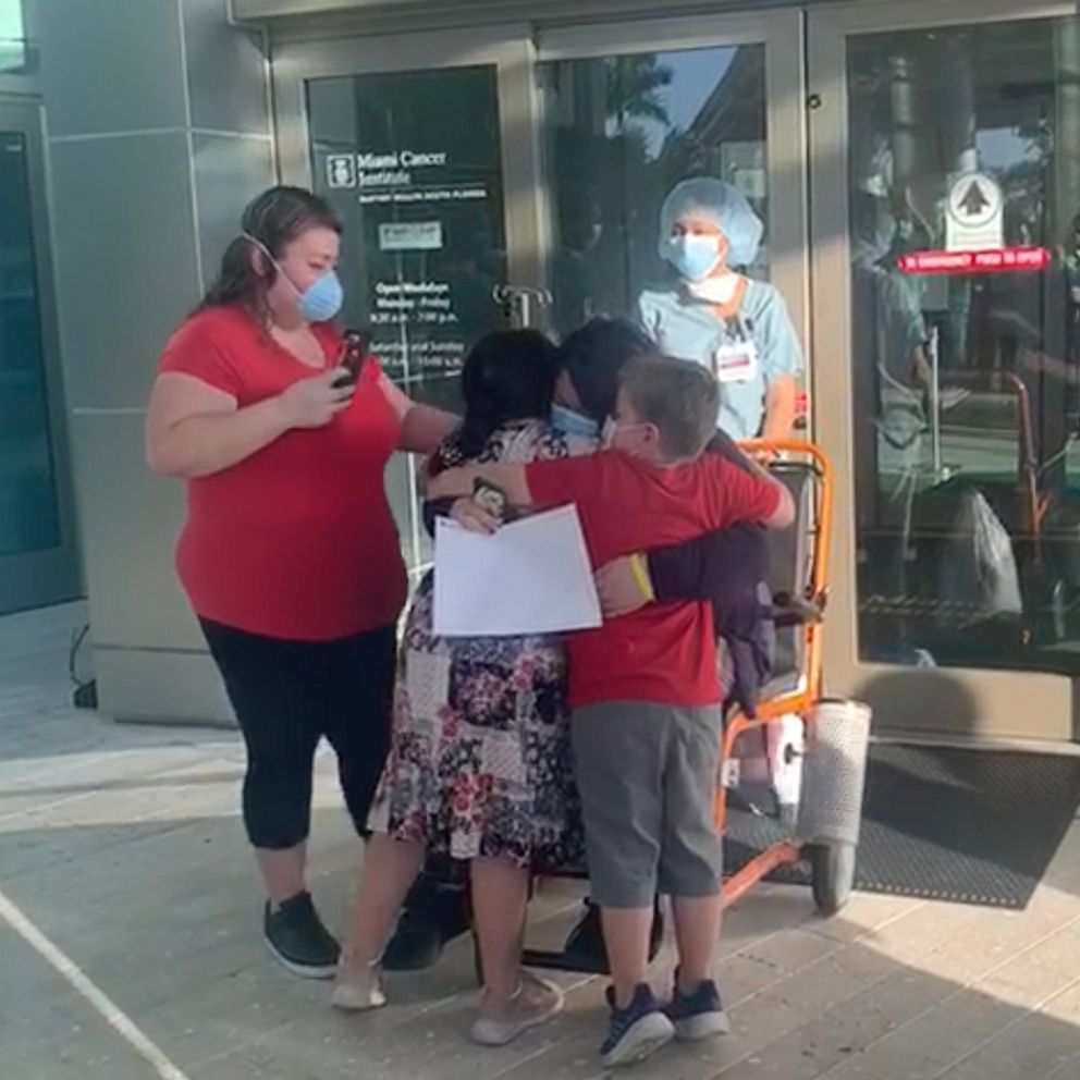 VIDEO: Single mom of two beats COVID-19 and reunites with kids after a month apart 