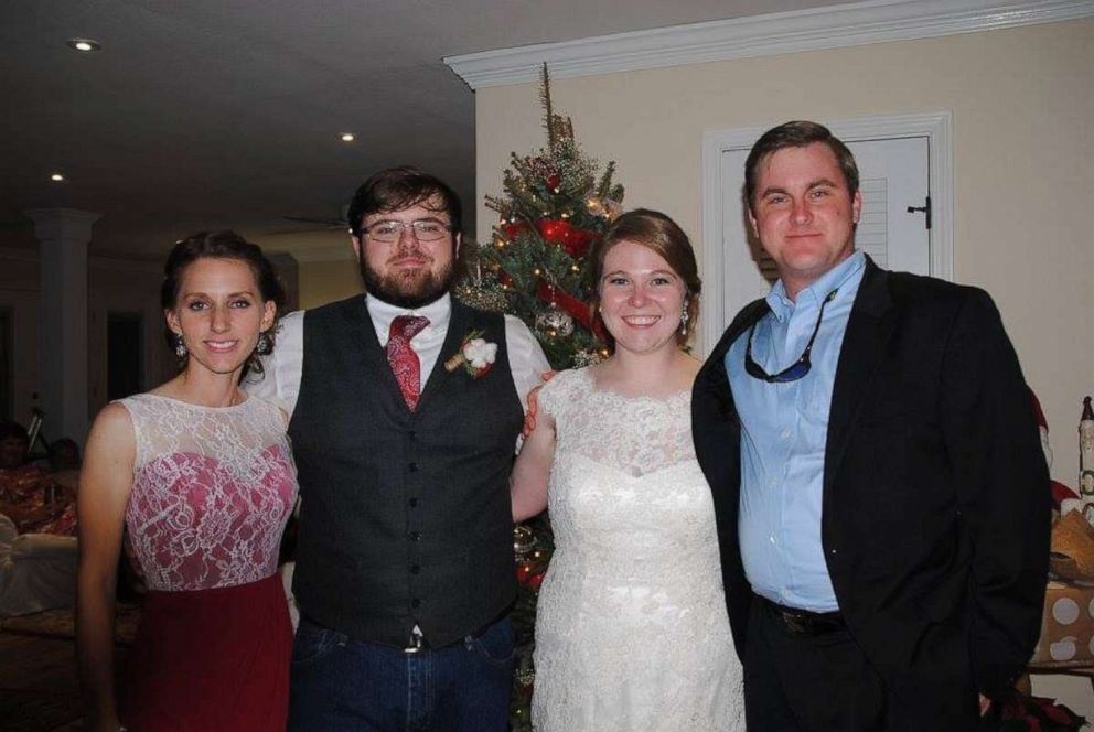 PHOTO: Jordan and Haley Richardson, center, pose on their wedding day with their close friends, Kari and Jason Whatley.