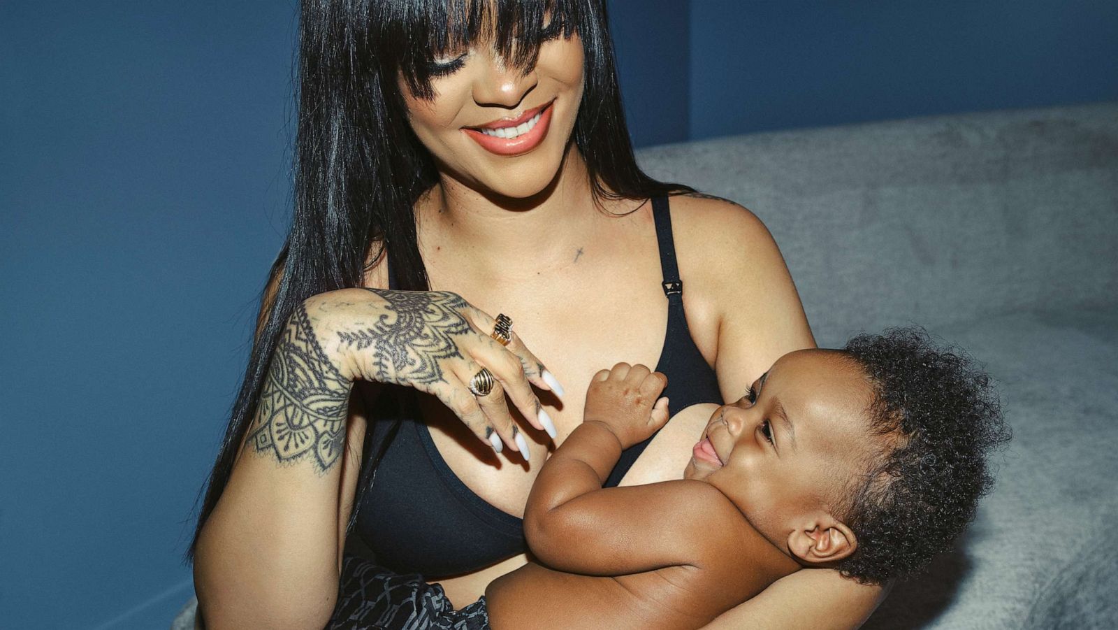 with a baby Louis Vuitton under her underarm