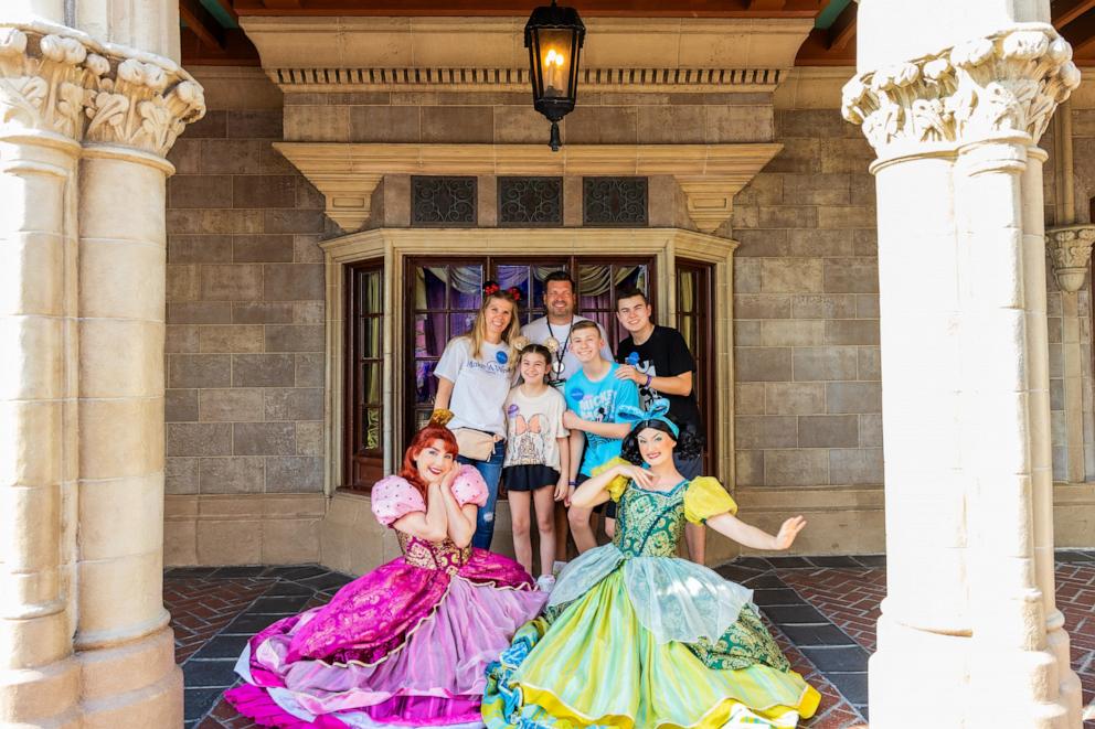 PHOTO: Rita poses for a photo with Cinderella’s stepsisters.