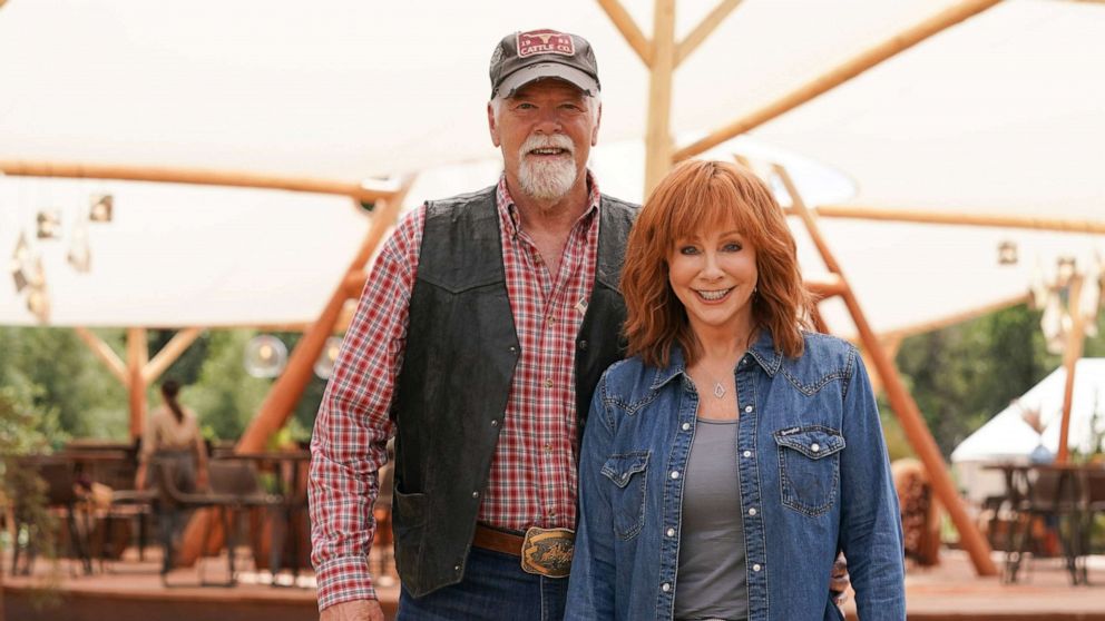 PHOTO: Rex Linn and Reba McEntire pose for a photo together on the set of ABC's "Big Sky: Deadly Trails."