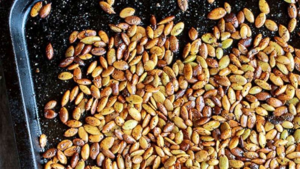 PHOTO: A sheet pan of roasted spiced pumpkin seeds. 