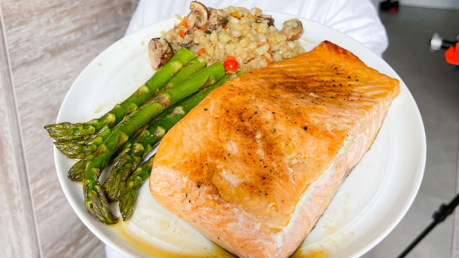 PHOTO: A plate of oven-roasted salmon and asparagus with fried vegetable cauliflower rice.