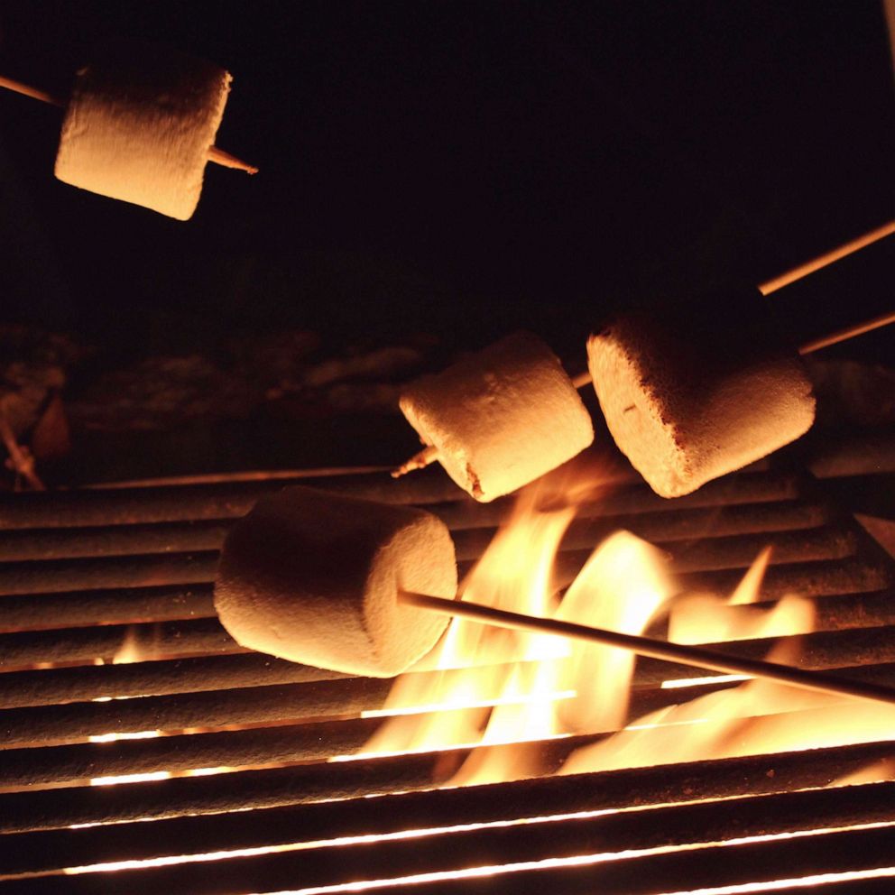 PHOTO: PRoasting marshmallows over a fire.