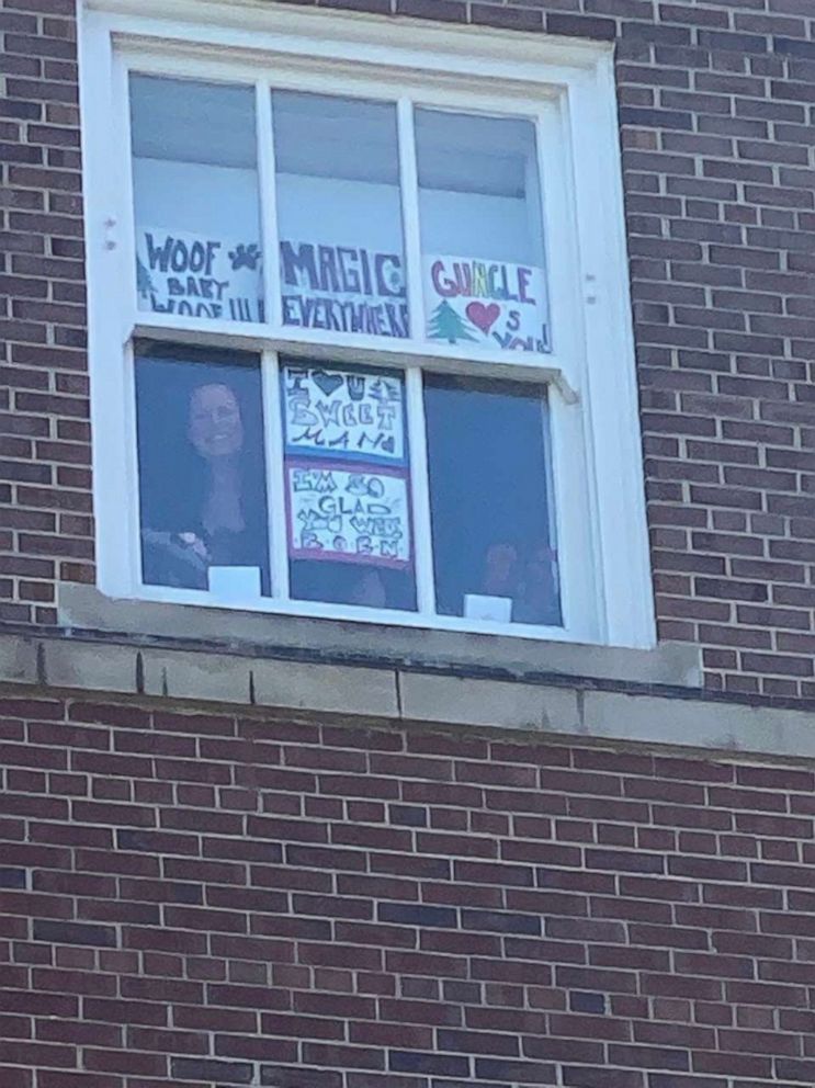 PHOTO: Robert Conlin, of Chicago, has been cheering on his pregnant wife Shona Moeller from outside the hospital due to COVID-19 restrictions.