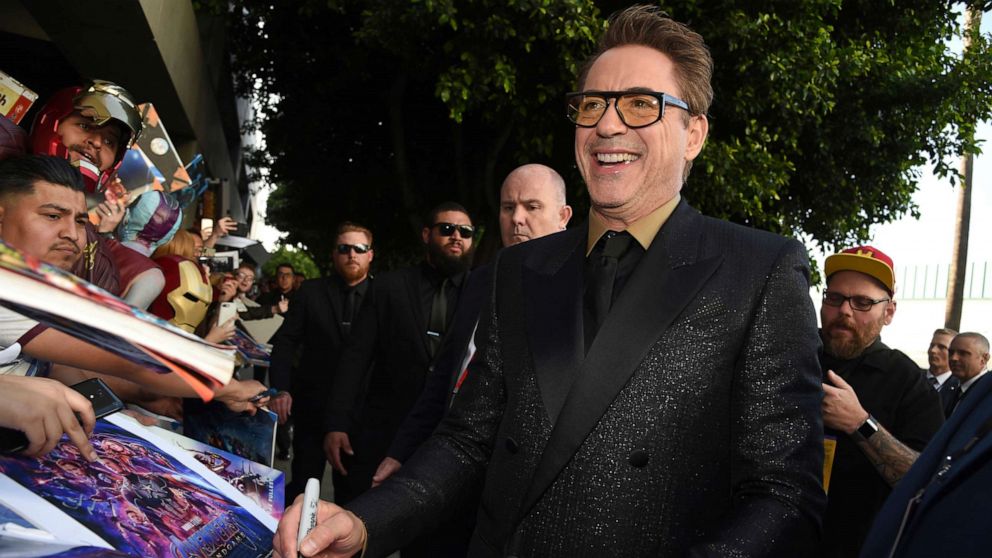 PHOTO: In this April 22, 2019, file photo Robert Downey Jr. signs autographs as he arrives at the premiere of "Avengers: Endgame" at the Los Angeles Convention Center.