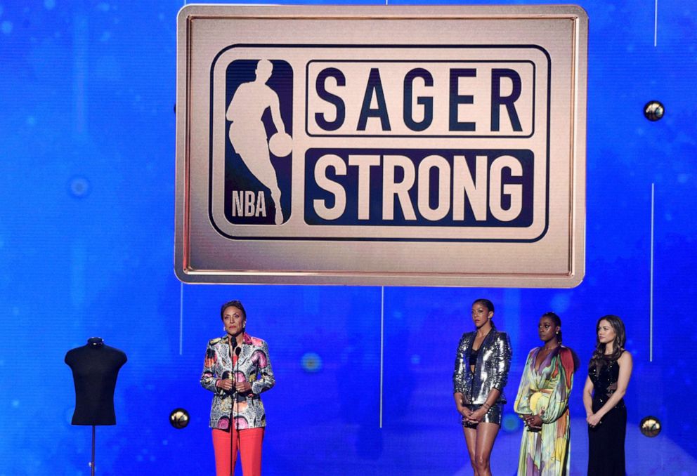 PHOTO: Robin Roberts accepts the Sager strong award at the NBA Awards on June 24, 2019, in Santa Monica, Calif. Looking on from second right are Issa Rae and Candace Parker.