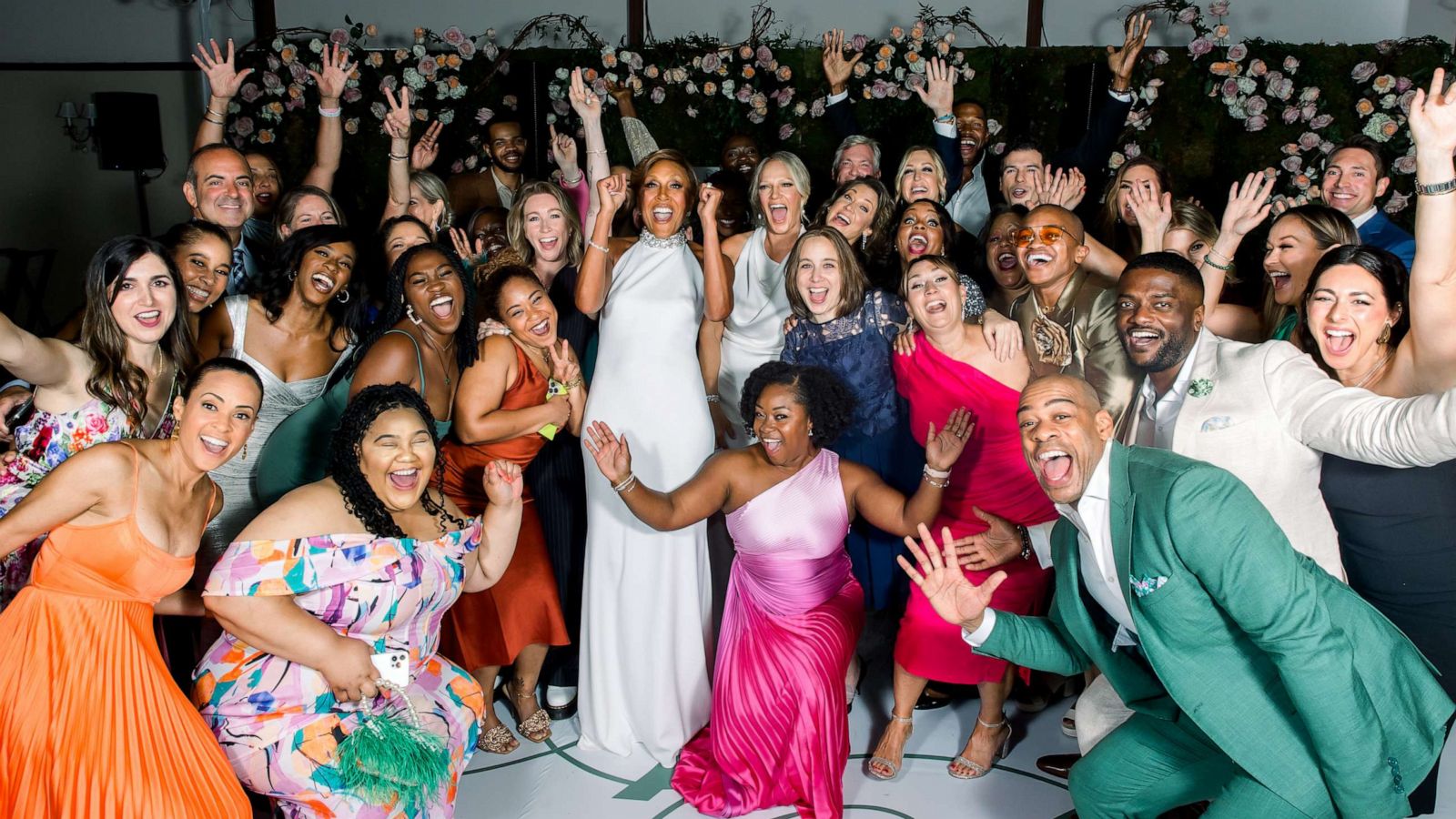 PHOTO: Robin Roberts and Amber Laign are surrounded by the production teams from "Good Morning America" and ABC News at their wedding celebration.