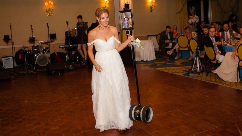 VIDEO: Devoted maid of honor refuses to miss sister's wedding, so she uses a robot to give her speech