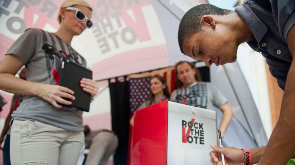 PHOTO: Rock the Vote members talk to students about voting