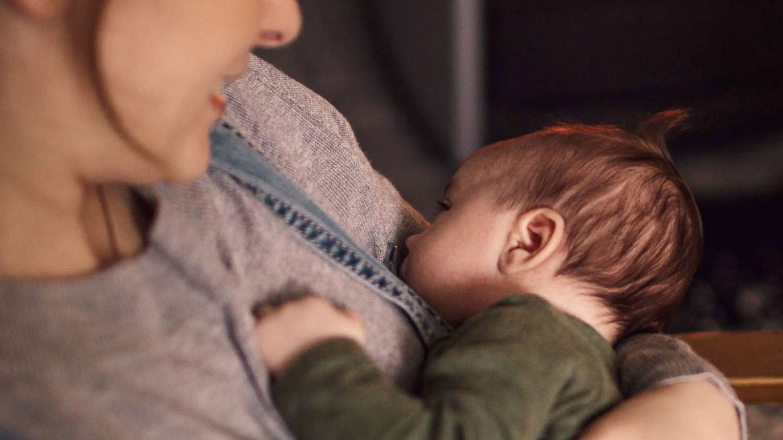 PHOTO: In this undated stock photo, a young mother rocks her newborn baby to sleep.