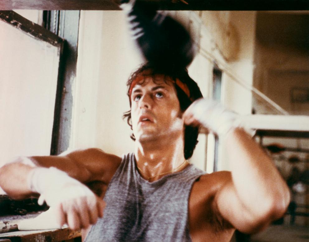 PHOTO: Sylvester Stallone as boxer Rocky Balboa trains with punchbag in the 1976 film "Rocky."