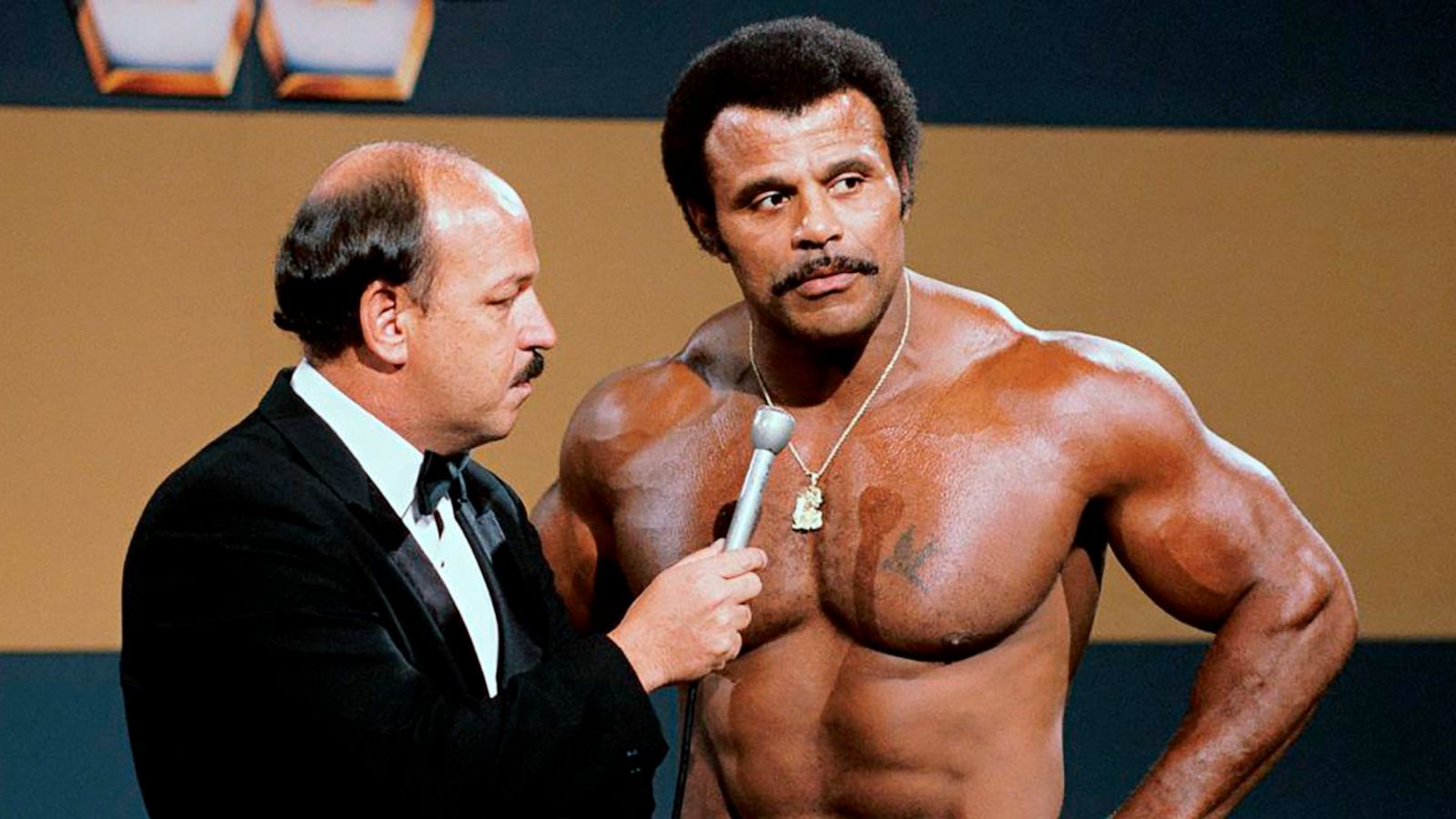 PHOTO: In this undated photo provided by WWE Inc., "Mean" Gene Okerlund interviews Rocky "Soul Man" Johnson, a WWE Hall of Fame wrestler who became better known as the father of actor Dwayne "The Rock" Johnson, died Wednesday, Jan. 15, 2020, at 75.