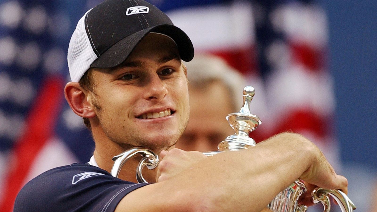 PHOTO: Andy Roddick of the United States hugs the trophy after defeating Juan Carlos Ferrero of Spain in the men's finals, Sept. 7, 2003, at the US Open tennis championships in Flushing Meadows, N.Y.