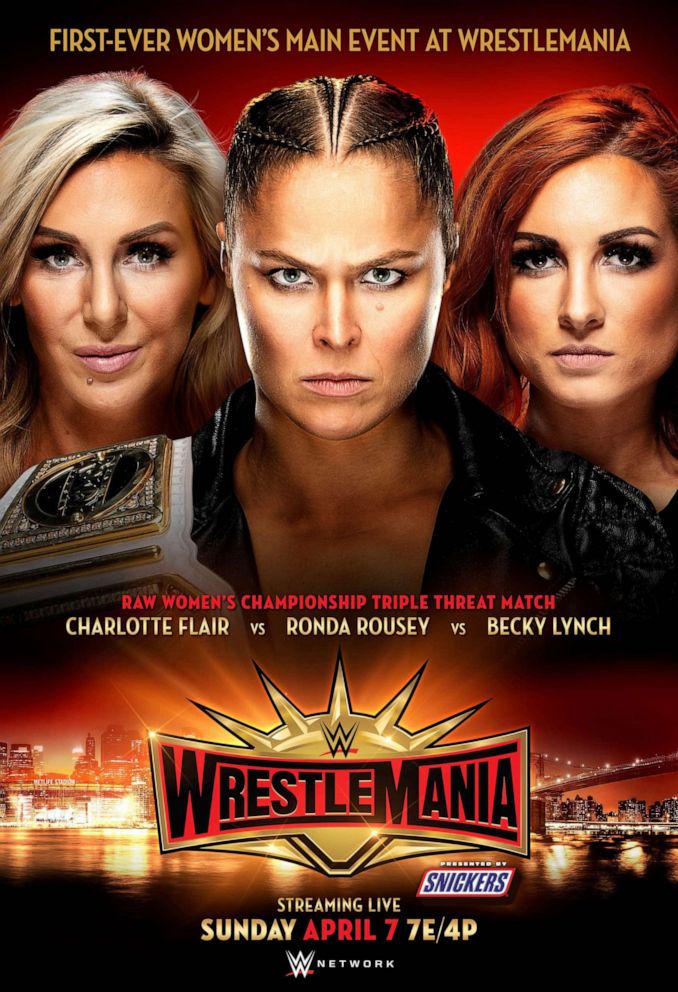 PHOTO: WWE wrestlers Charlotte Flair, Ronda Rousey and Becky Lynch are pictured in a promotional poster for WrestleMania 35.