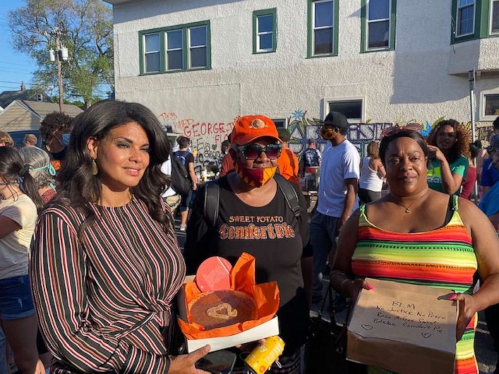 PHOTO: Rose McGee (center) delivers her Sweet Potato Comfort Pies at the George Floyd memorial in Minnesota. 