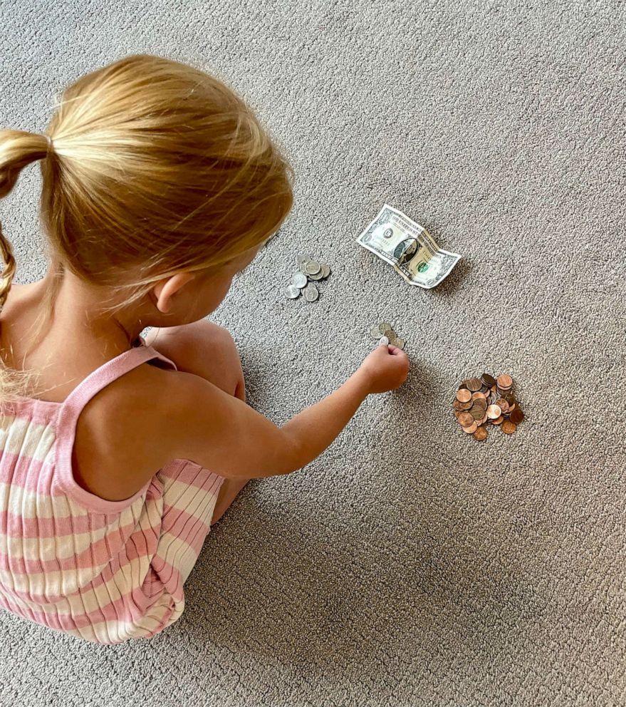 PHOTO: One of the "how to be a person camp" activities Rowe has done with her 6-year-old daughter is "how to give change/count money."