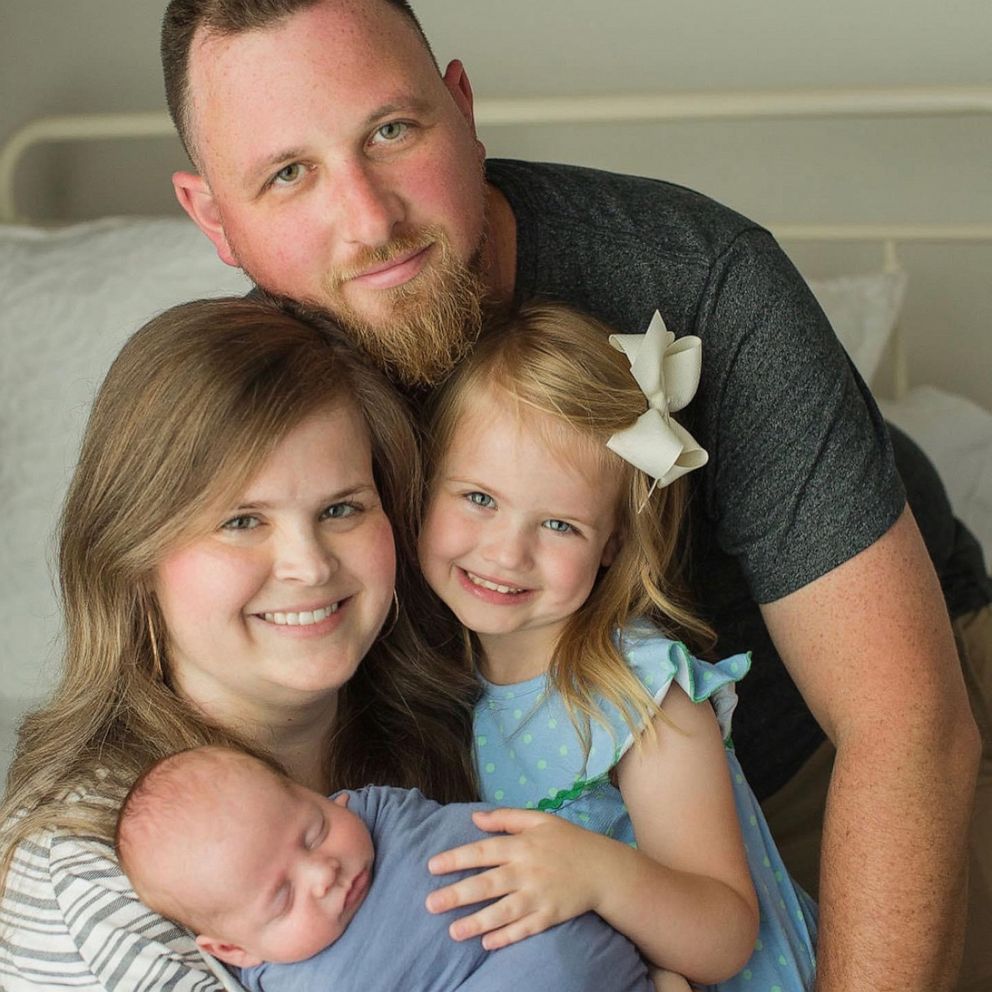 PHOTO: Jessica and James Rowlett pose with their daughter Poppy, 4, and newborn son Rowdy.