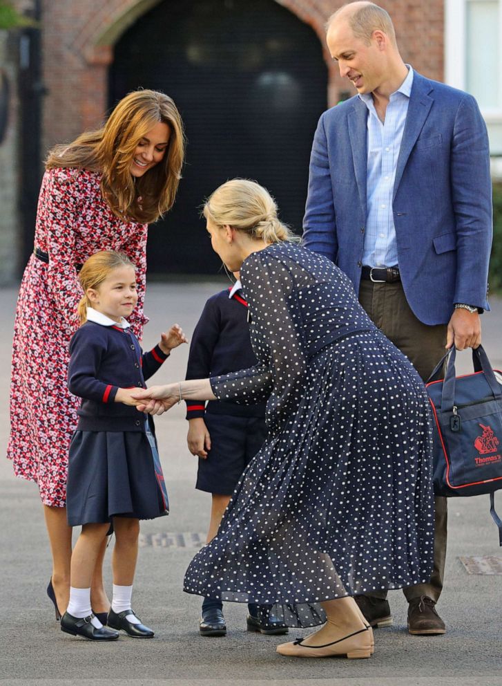 PHOTO:Helen Haslem, head of the lower school greets Princess Charlotte as she arrives for her first day of school, with her brother Prince George and her parents the Duke and Duchess of Cambridge, at Thomas's Battersea in London, Sept. 5, 2019, in London.