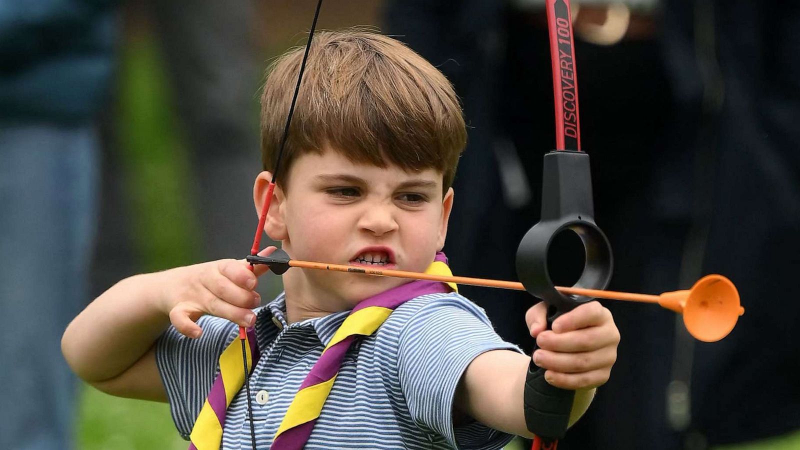 PHOTO: Prince Louis of Wales tries his hand at archery while taking part in the Big Help Out, during a visit to the 3rd Upton Scouts Hut in Slough, west of London on May 8, 2023.