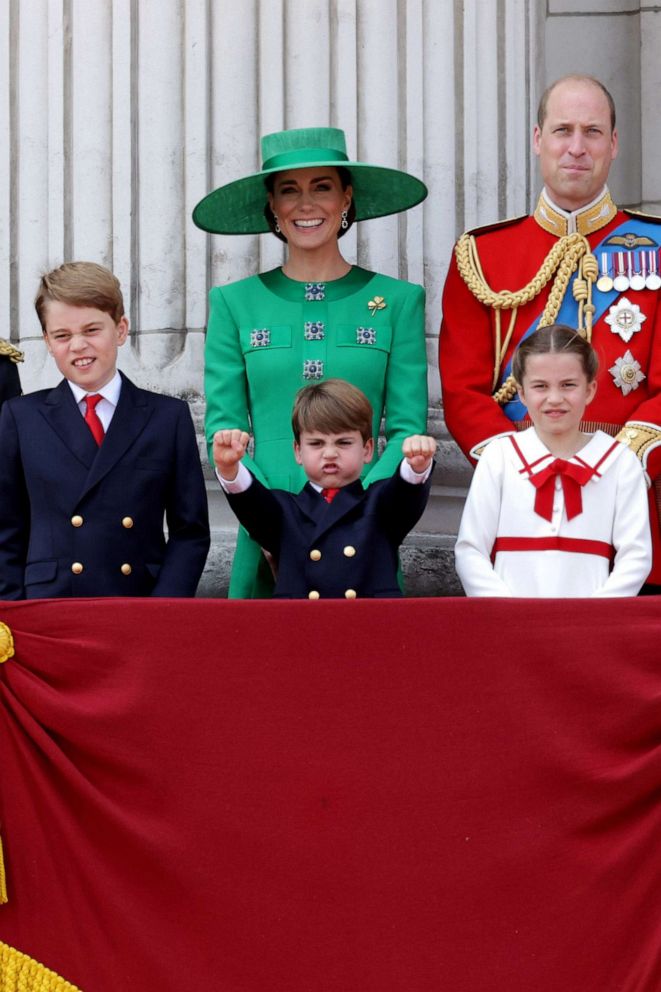 PHOTO: Prince George of Wales, Prince Louis of Wales, Catherine, Princess of Wales, Princess Charlotte of Wales and Prince William, Prince of Wales stand on the balcony of Buckingham Palace to watch a fly-past of aircraft by the Royal Air Force