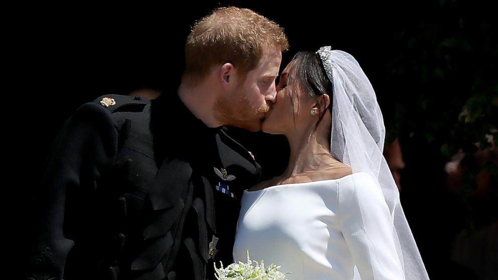 PHOTO: Prince Harry, Duke of Sussex and The Duchess of Sussex share a kiss after their wedding at St George's Chapel at Windsor Castle, May 19, 2018 in Windsor, England. 