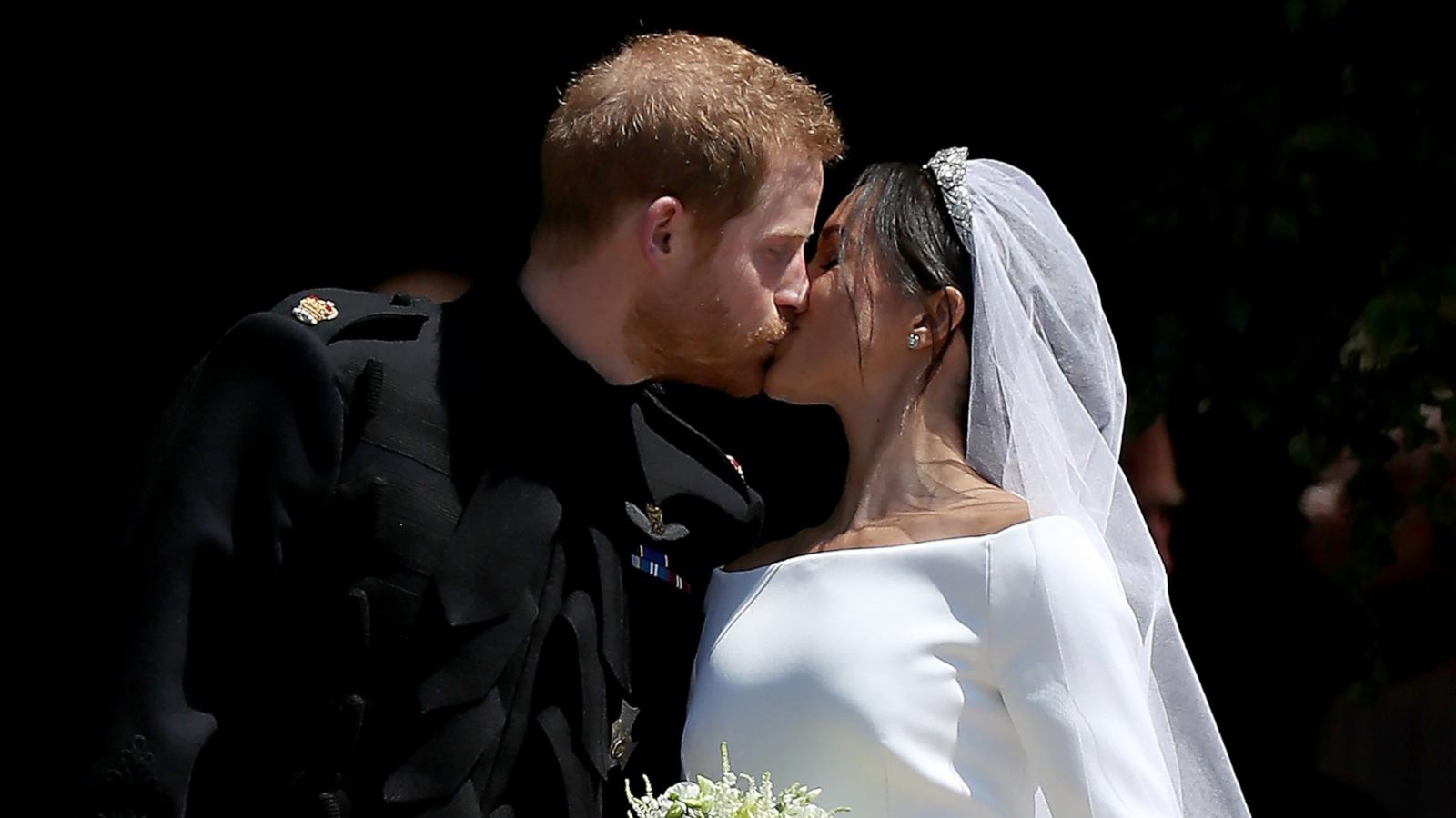 PHOTO: Prince Harry, Duke of Sussex and The Duchess of Sussex share a kiss after their wedding at St George's Chapel at Windsor Castle, May 19, 2018 in Windsor, England.