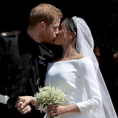 PHOTO: Prince Harry, Duke of Sussex and The Duchess of Sussex share a kiss after their wedding at St George's Chapel at Windsor Castle, May 19, 2018 in Windsor, England. 