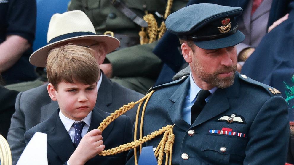 PHOTO: William, Prince of Wales and Prince Louis sit in attendance on the day of the armed forces and veterans' parade commemorating the 80th anniversary of Victory in Europe (VE) Day in London, May 5, 2025.
