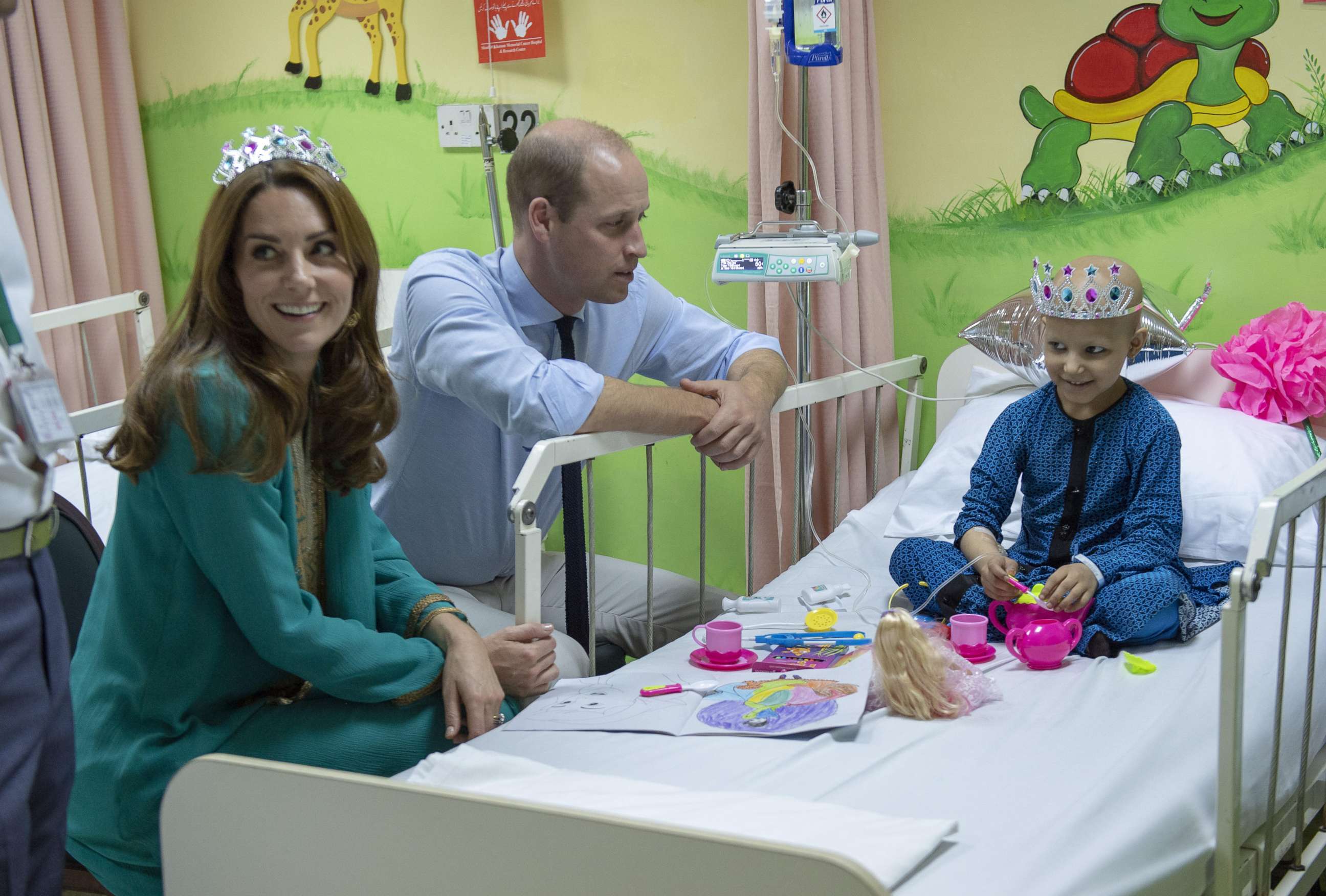 PHOTO: The Duke and Duchess of Cambridge with seven-year-old cancer patient Wafia Remain, during a visit to Shaukat Khanum Memorial Cancer Hospital and Research Centre in Lahore, Pakistan, Oct. 17, 2019, on the fourth day of the royal visit to Pakistan.