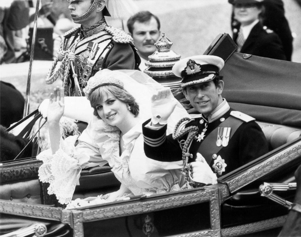PHOTO: Princess Diana and Prince Charles of Wales wave to the crowd from their carriage following their wedding ceremony, London, July 29, 1981.