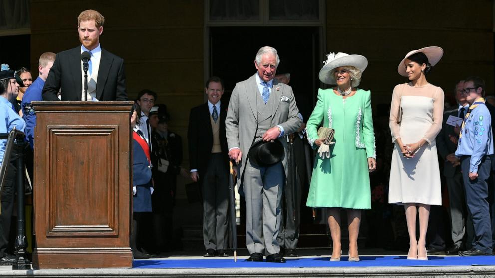 PHOTO: Prince Harry, Duke of Sussex speaks as Prince Charles, Prince of Wales, Camilla, Duchess of Cornwall and Meghan, Duchess of Sussex listen during The Prince of Wales' 70th Birthday Patronage Celebration, May 22, 2018, in London.
