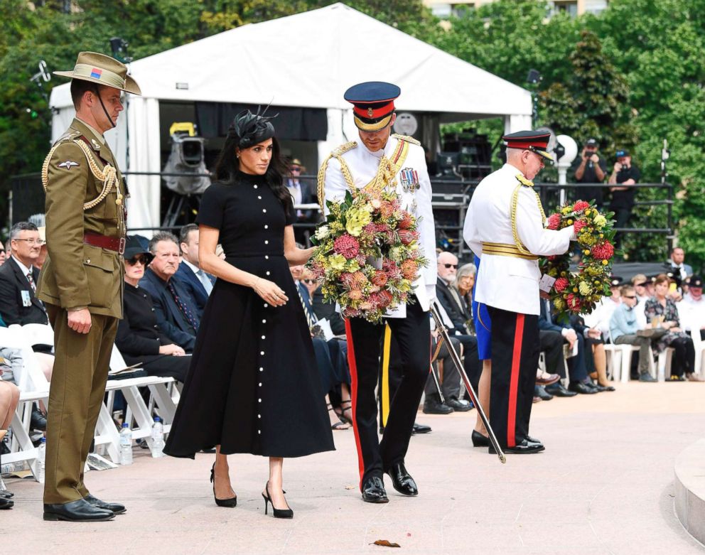 PHOTO: Britain's Prince Harry and his wife Meghan, Duchess of Sussex lay a wreath at the official opening of the ANZAC Memorial at Hyde Park in Sydney on Oct. 20, 2018. 