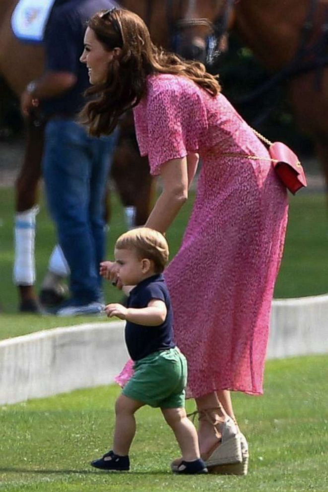 PHOTO: Catherine Duchess of Cambridge and Prince Louis are seen walking at the King Power Royal Charity Polo Day at Billingbear Polo Club in Wokingham, UK on July 10, 2019.