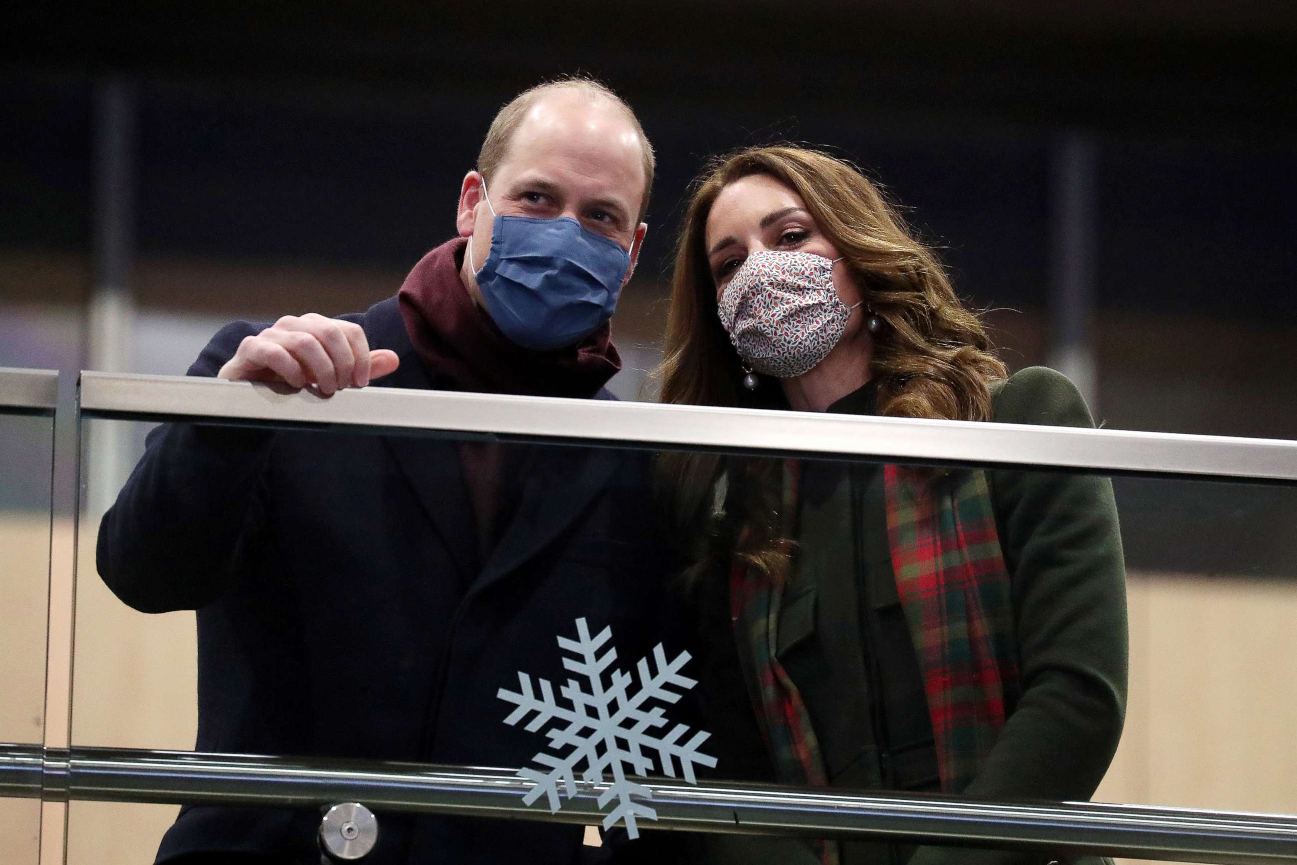 PHOTO: Prince William and Catherine, Duchess of Cambridge, look on from the balcony at London Euston Station, as they embark on a three-day tour aboard the Royal train to thank frontline staff and community workers in the UK, in London, Dec. 6, 2020. 