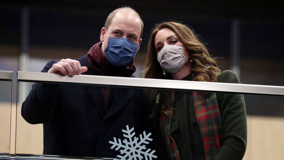 PHOTO: Prince William and Catherine, Duchess of Cambridge, look on from the balcony at London Euston Station, as they embark on a three-day tour aboard the Royal train to thank frontline staff and community workers in the UK, in London, Dec. 6, 2020. 